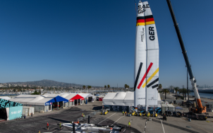 Crane lifting F50 sails 